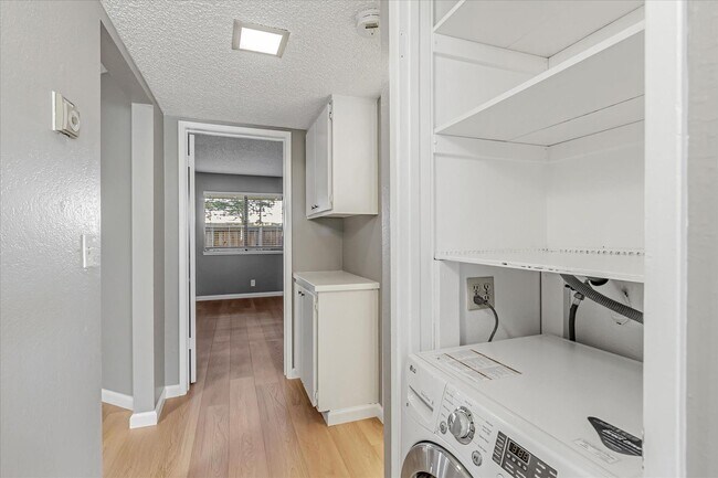 Building Photo - Stylish End-Unit Condo l Private Patio l Community Pool