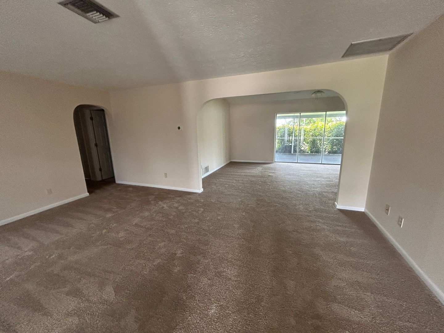 Building Photo - Freshly painted interior and new carpet in living room spacious home off Country Club Blvd