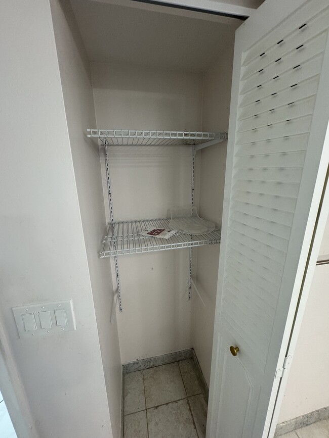 Linen closet (identical in both bathrooms) - 1865 S Ocean Dr