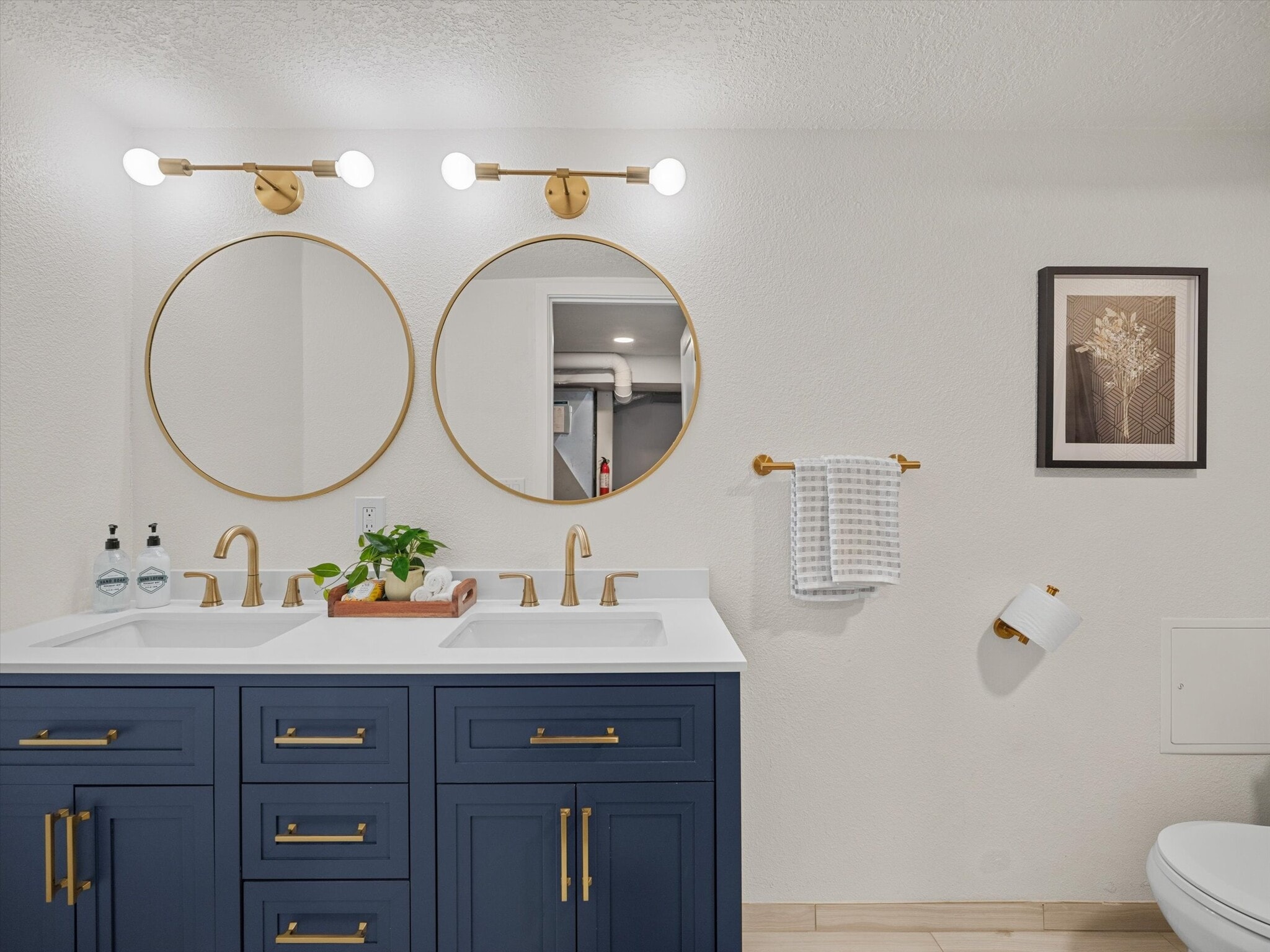 The recently remodeled downstairs bathroom has a spacious shower. - 9835 SW 80th Ave