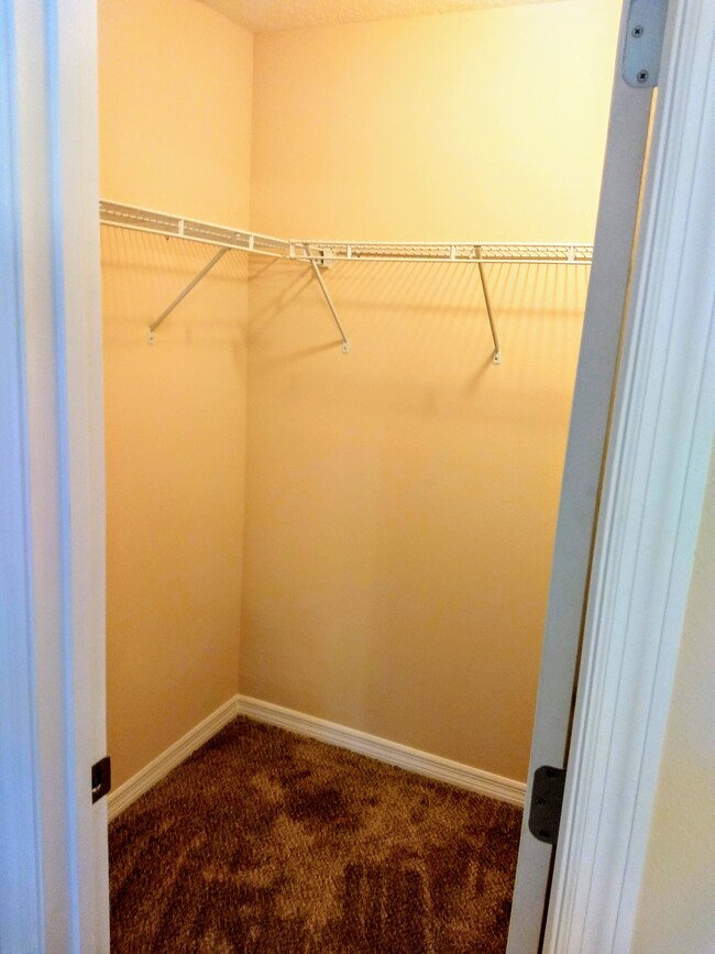 Main bedroom walk-in closet - 9356 N Peachtree Way