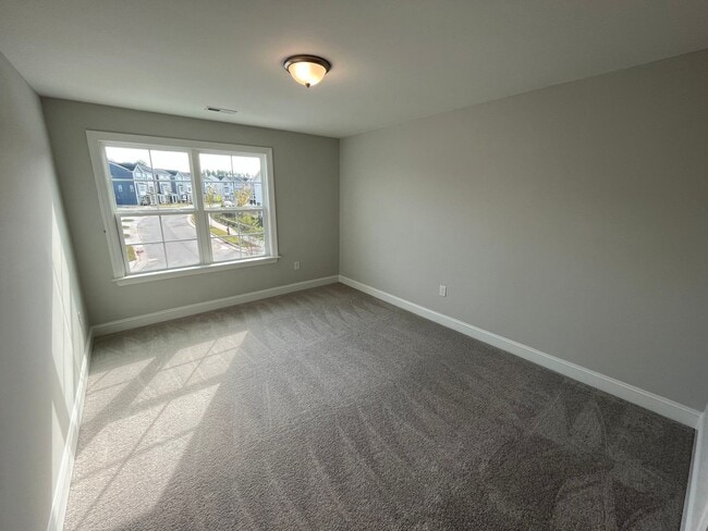 Building Photo - Newly Built 4BD, 3BA Cary Townhome with Modern Amenities and Screened-In Patio