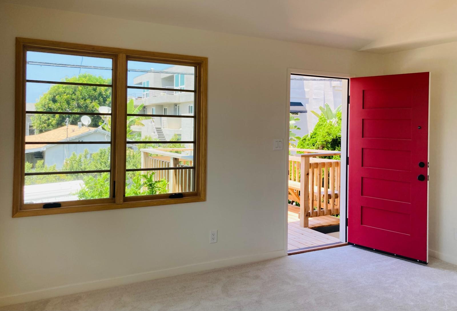 view from living room to entry door and deck - 624 Bonair St