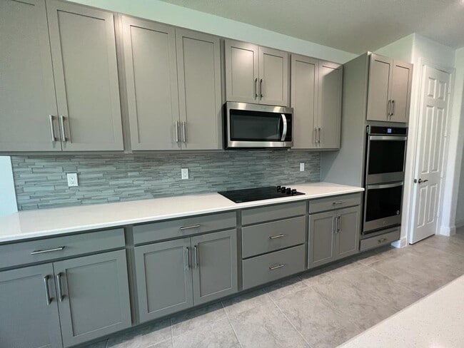 Building Photo - This Charming Brand-New Home is a 4/3 with...