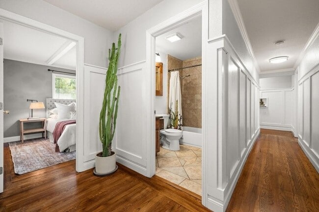Building Photo - Welcome to this stunning 4-bedroom, 2-bath...