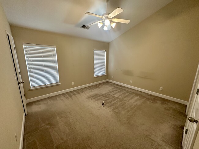 Bedroom 1 with walk in closet and full bath - 8608 Gauphin Pl