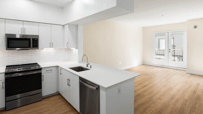 Kitchen with Stainless Steel Appliances - South City Station