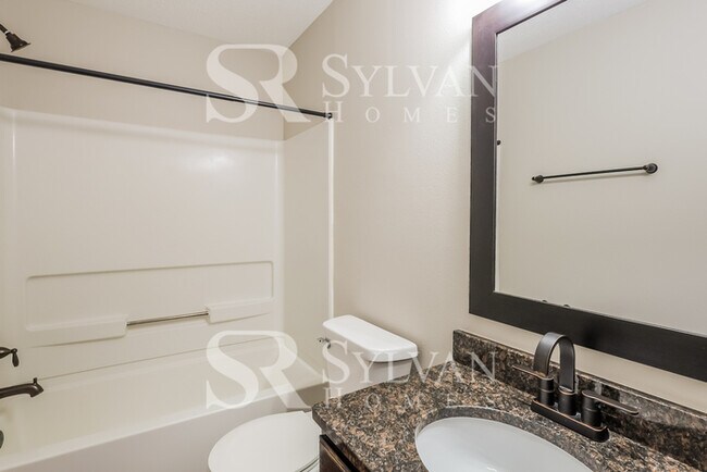 Building Photo - This lovely 4BR, 2.5BA home is move-in ready