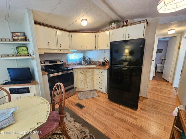 Building Photo - 55+ in Quiet Gated Community