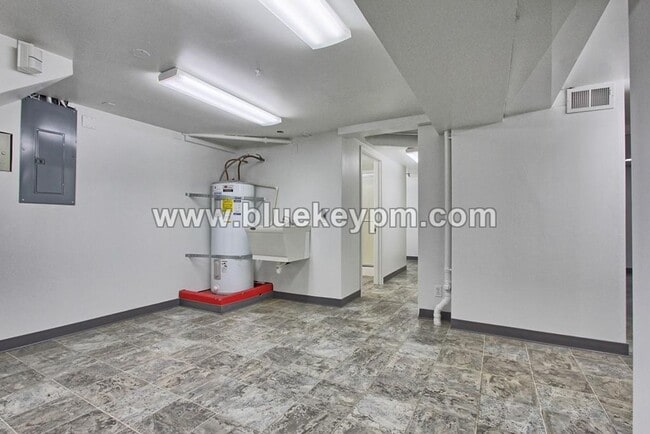 Building Photo - 4 Bedroom, 2 Bath Home with Primary on Main Floor, Basement and Large Fenced Yard