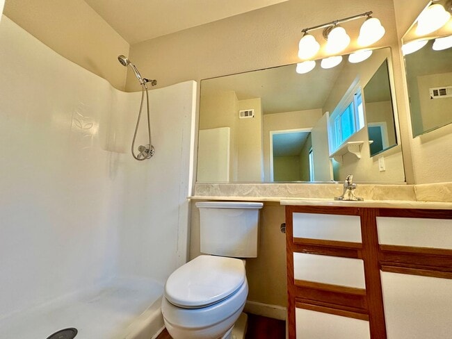 Building Photo - Remodeled 4 bedroom with central A/C and 2 car garage!