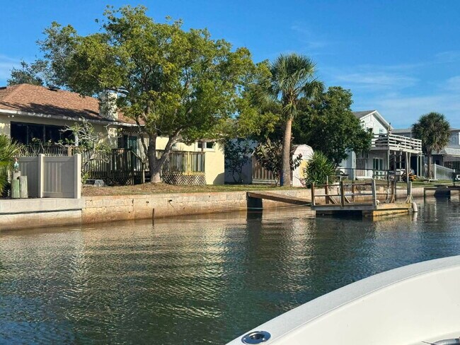 Building Photo - "Waterfront Home with Dock! 3-Bedroom Oasis with 2 Baths and 1,800 Sq Ft of Comfort in Hudson, FL!"