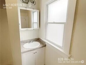 Building Photo - "Charming 3-Bedroom Oasis: Your Perfect Bl...