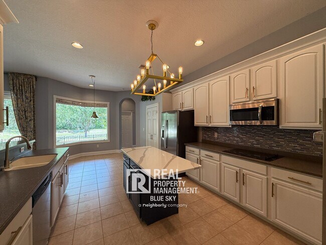 Building Photo - Executive Home with Custom Finishes in Gat...