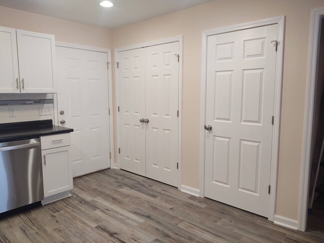 Doors to exterior, laundry closet and storage space - 230 E Meadowlake Pky