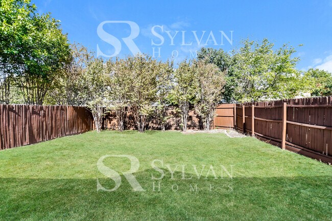 Building Photo - The living is easy in this gorgeous 4BR, 2.5BA brick home