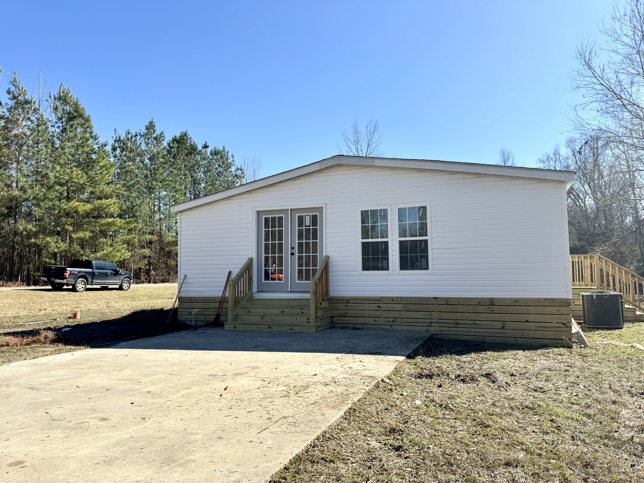 Side Entrance and Patio - 525 Horsefly Rd