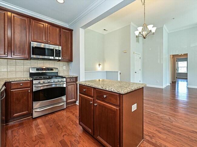 Building Photo - Stylish Condo Living with Open Concept, Garage & Outdoor Space