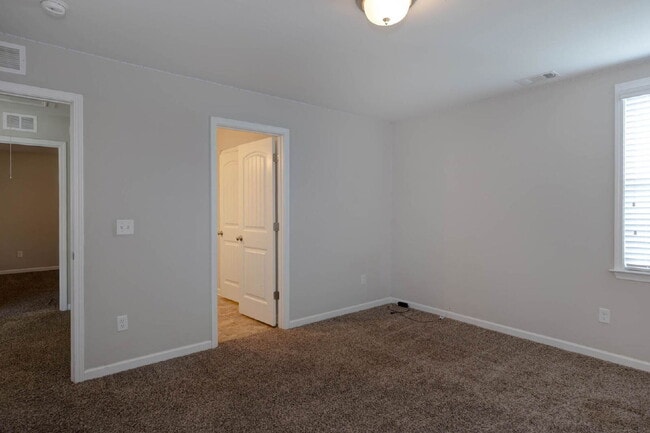 Building Photo - 4BR/3.5BA · 2,809 SF · Owner's Suite on Main · Fenced Yard · Midland, GA — $2,800/mo