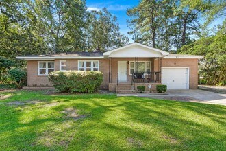 Building Photo - Classic Brick Ranch with Modern Updates and Expansive Backyard