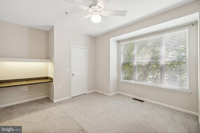 Building Photo - This townhouse style condo is located across the street from the Vienna Metro Station (Orange Line).