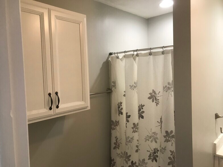 Bathroom storage cabinet - 4617 Yates Mill Pond Rd