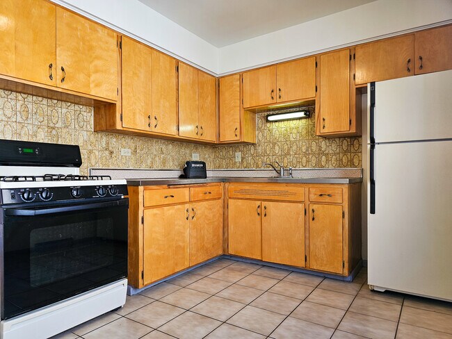 Building Photo - 5950 W Schubert Ave