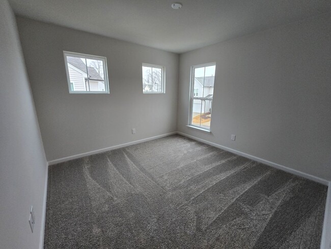 Building Photo - NEWLY BUILT END UNIT TOWNHOME