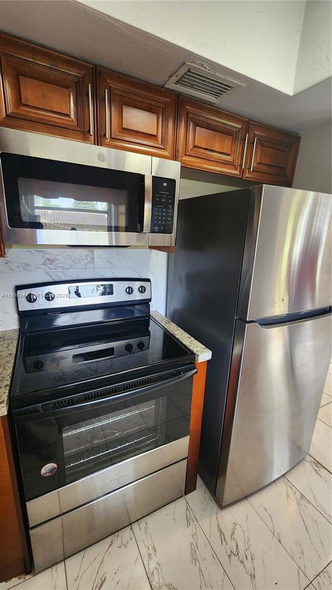 Building Photo - 3090 Coral Springs Dr