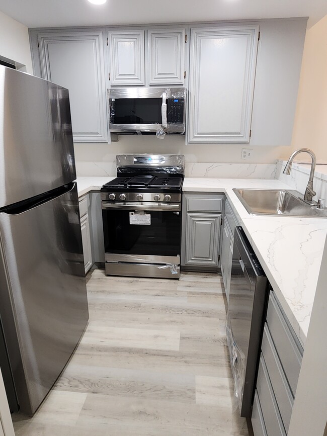 All new appliances and countertops - 8675 Falmouth Ave