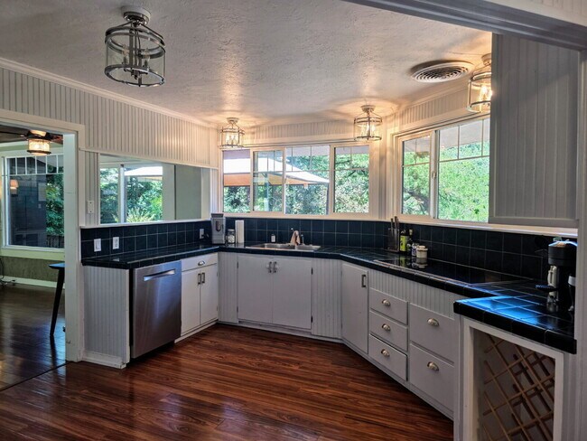 Building Photo - FOUR-BEDROOM HOME WITH PRIVATE SUITE, EXPANSIVE DECKS, GARAGE & WORKSHOP SPACE   Open House 1-2 P...
