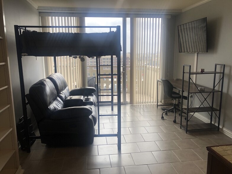 Loft bed w/double recliners, desk, small refri/micro, closet, full bath across hallway - 2016 Main St