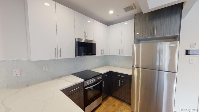 Building Photo - 138-28 Queens Blvd