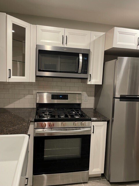 Gas range and built in microwave. - 214 E Vermilya Ave