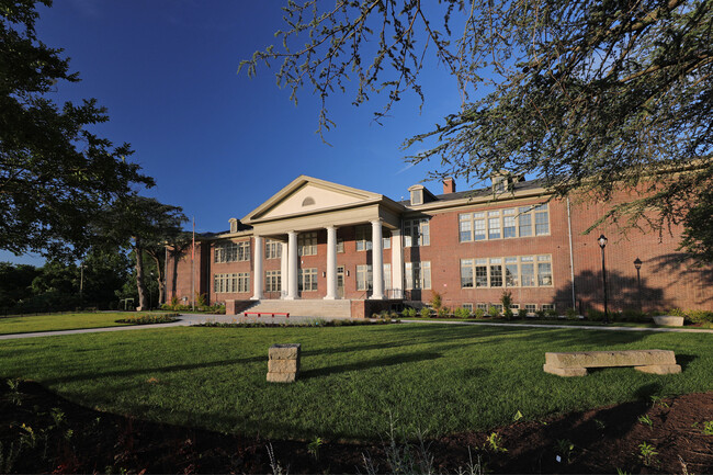 Schoolhouse exterior, front portico and lawn - Schoolhouse at Artisan Hill