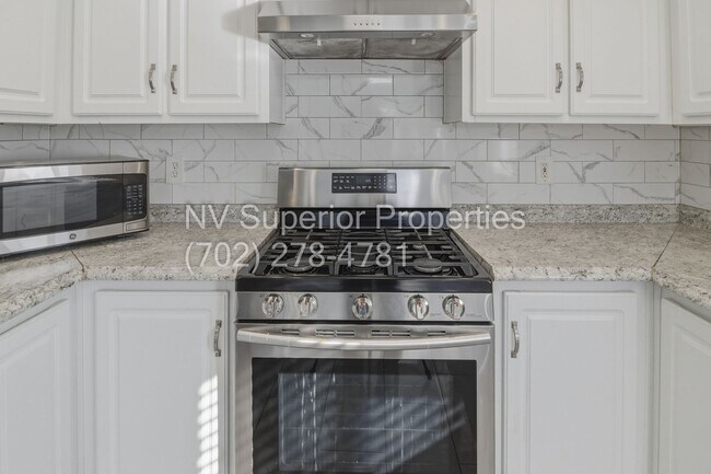 Building Photo - SE!!! 4 Bedrooms!! Master Downstairs!! No Carpet!! Synthetic Grass front and back!!