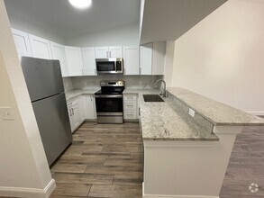 Building Photo - ANNUAL RENTAL - KEY ROYAL-2 BED 1 BATH THI...