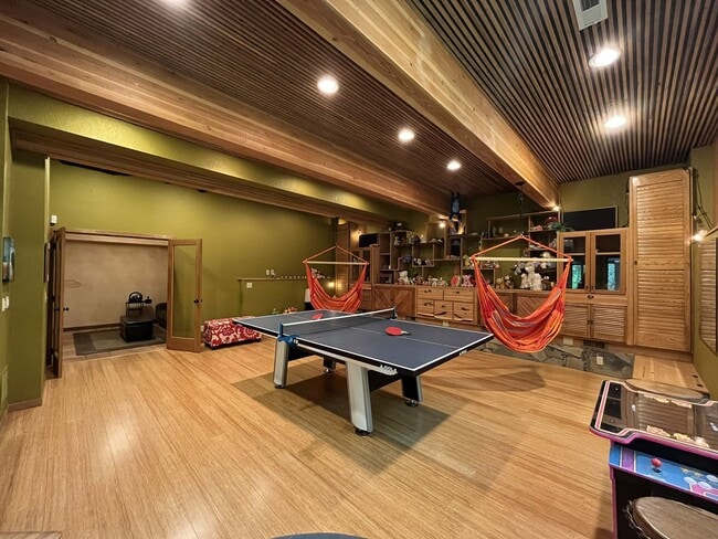 Building Photo - One-of-a-Kind Custom Home with Wall of Windows, Stone Fireplaces, Expansive Entertainment Space &...