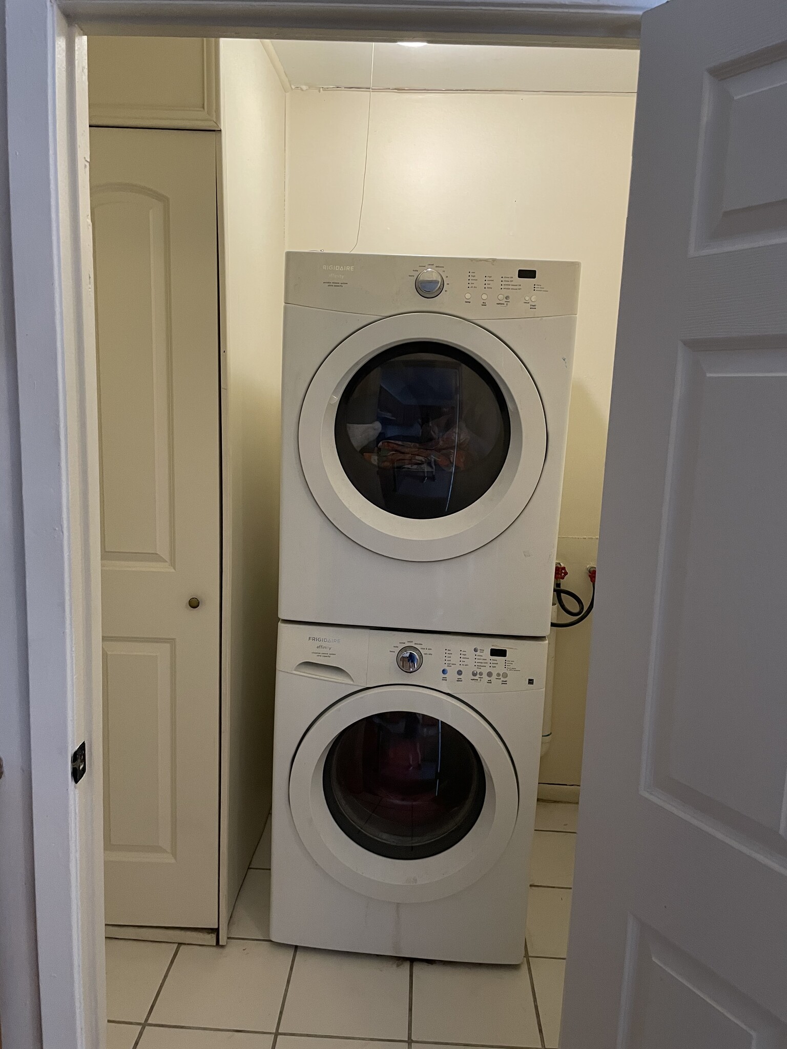 Washer and dryer. Water heater is in the cabinet to the left. - 1230 Mandeville St
