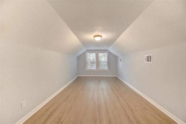 Spacious upstairs secondary room that can easily fit 2 queen beds and sitting area - 1519 7th St