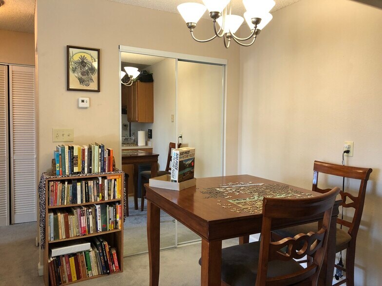 Storage with clothes rack behind glass doors. Dining Room too - 850 W Moorhead Cir