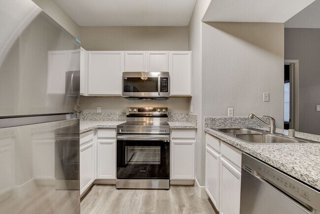 Building Photo - Upgrated upstairs 2 Bedrm 2 bath Gated Com...