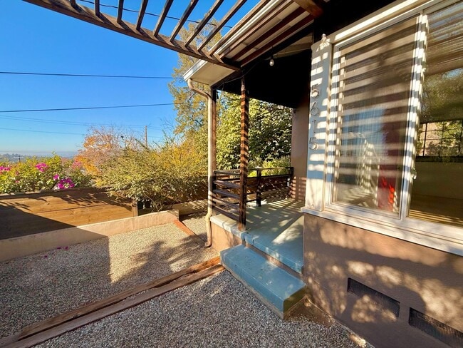 Building Photo - Hilltop Highland Park Sanctuary with Views, Private Gated Yard, In Unit Laundry, Parking & Abunda...