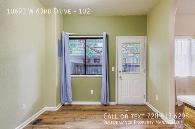 Building Photo - 10693 W 63rd Dr