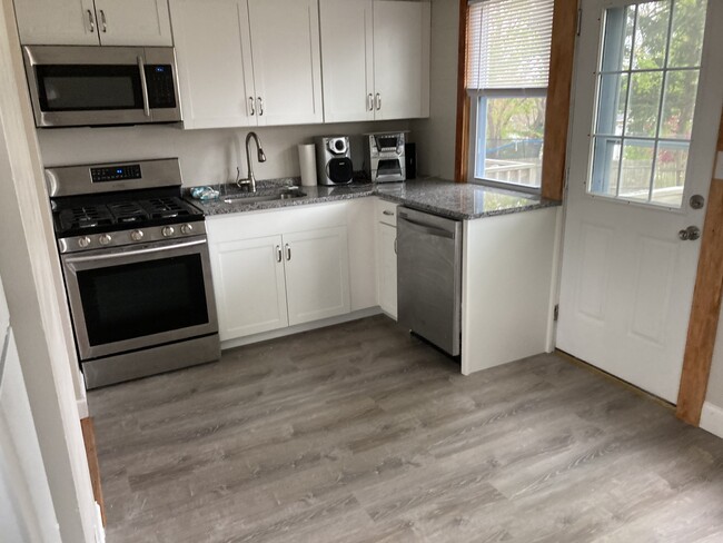 Brand new kitchen with small deck to backyard - 53 Sagamore Rd