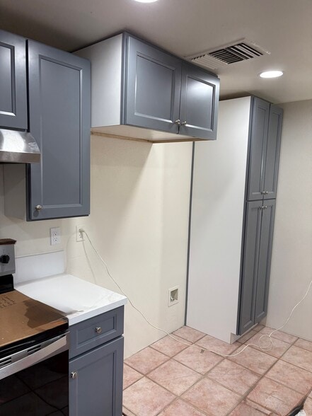 Turning left now, you see the new pantry cabinets and area for your refrigerator including water - 23162 Smith Rd