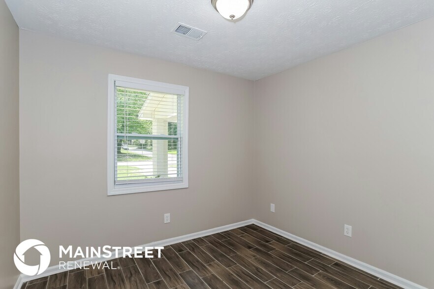 Building Photo - 9073 Woodgreen Way