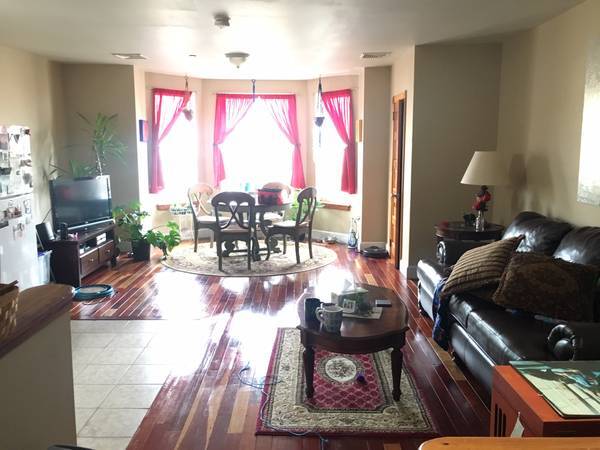 open floor Kitchen and LR on 3rd floor. Full bath and 2 BRs with closets behind photographer. - 1122 South 46th Street