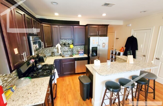 Building Photo - Spacious Townhouse: 4-bed, 3.5 bath unit in Brighton with Garage Parking