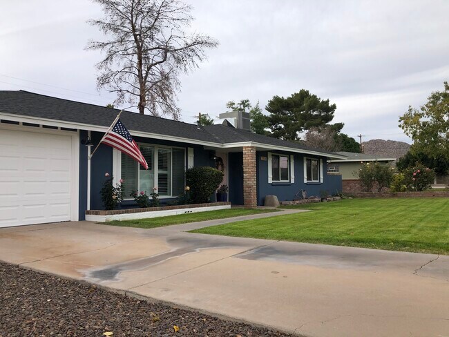 Front yard. Driveway + 1-car garage - 3344 N 62nd Plz